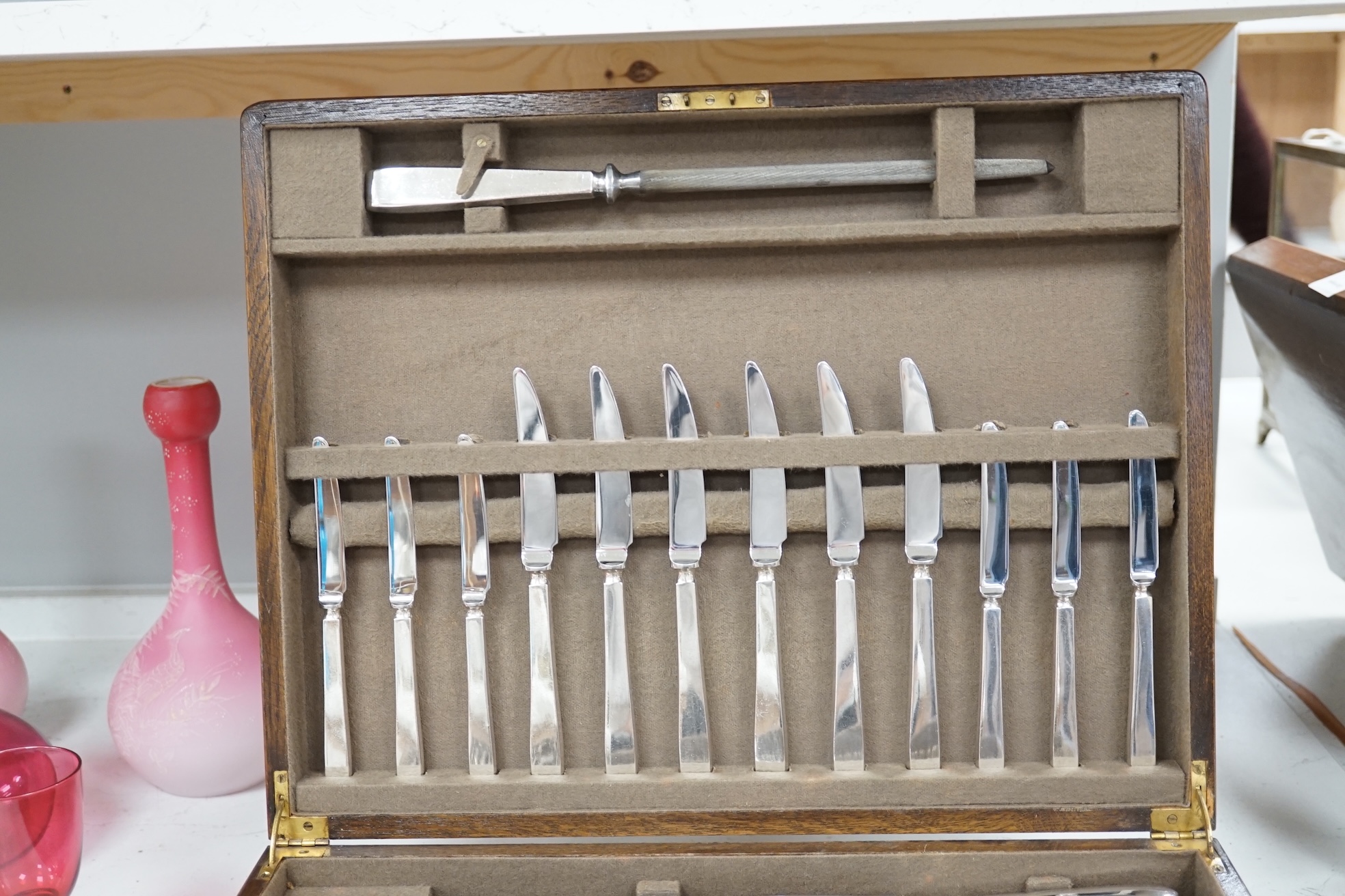 A Mappin and Webb oak canteen of silver plated cutlery, case 44 x 35 x 11cm. Condition fair to good, some staining to top of canteen, contents good.